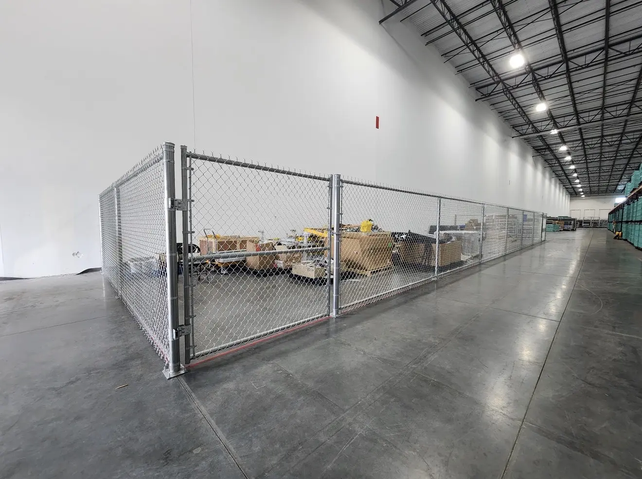 Galvanized chain-link storage cage and double gate installed inside Hyundai Glovis in Pembroke