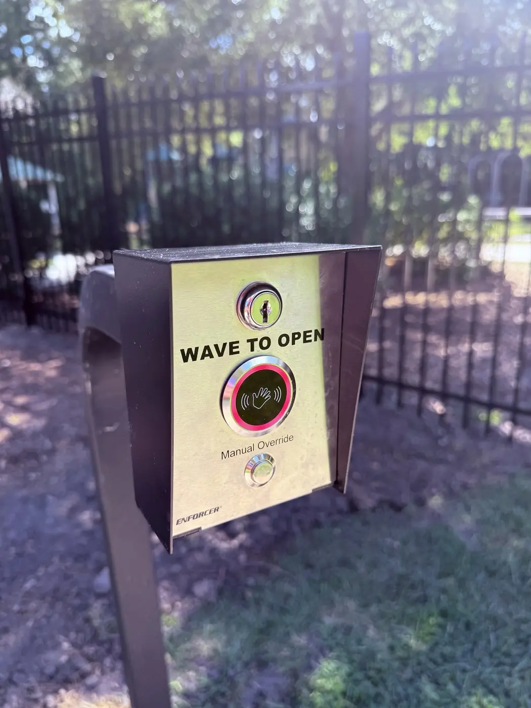 Wave-to-open contactless exit control with manual override at the Buckhead East pool