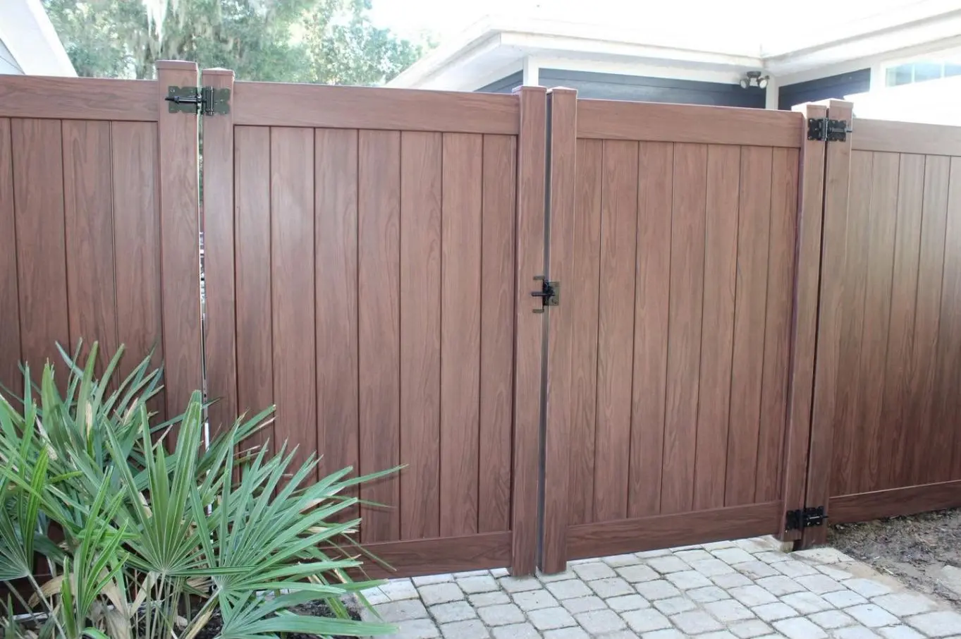Rosewood vinyl privacy fence installed in Yellow Bluff at Midway
